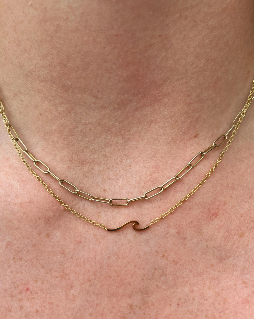 Subtle small gold wave necklace