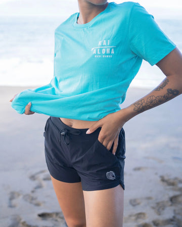 The waist band is stretchy with a drawstring for even more adjustment. The left side of the shorts has a side pocket and at the front bottom left, our KaiAloha wave logo. The right side of the shorts has a side pocket and a zipper.