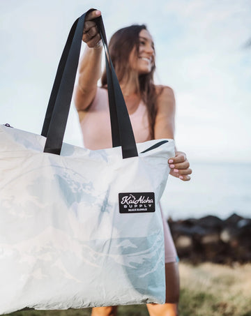 All outside closures are made with a waterproof zipper! The Tote bag features an additional accessory zip pocket inside for your phone and keys. Made with Aloha!